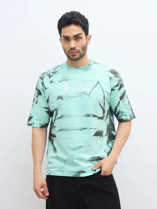 Mint Green Spray Print T-Shirt – "अंतः अस्ति प्रारंभः" (The End is the Beginning)