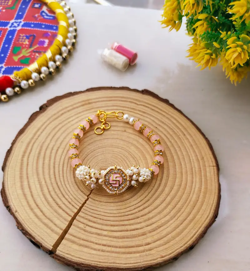 Pastel Pink Swastik Beaded Lumba Bracelet Rakhi for Bhabhi product image