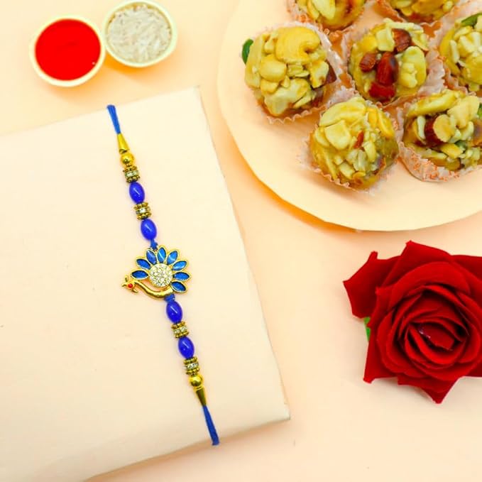 Peacock Rakhi with Dry Fruits Laddu Gift Hamper, Greeting Card, Roli Kumkum and Sweet Box product image